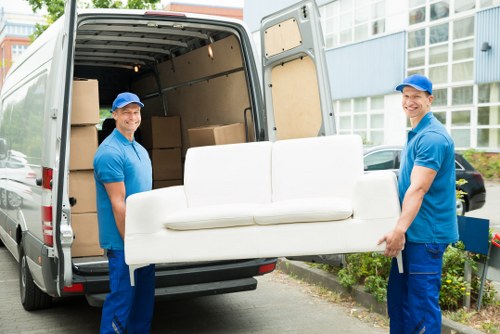 Furniture collection team loading a sofa in Westminster