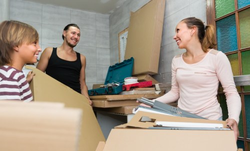 Packed household boxes and furniture ready for a Westminster move