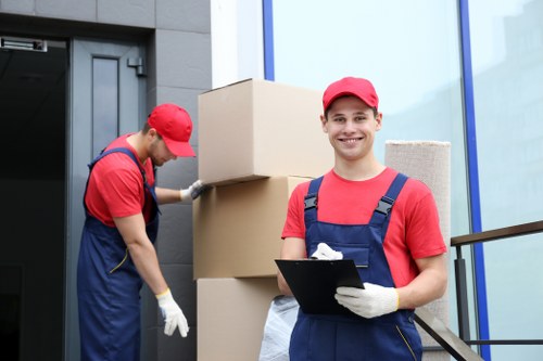 Professional movers handling office equipment during a Westminster relocation